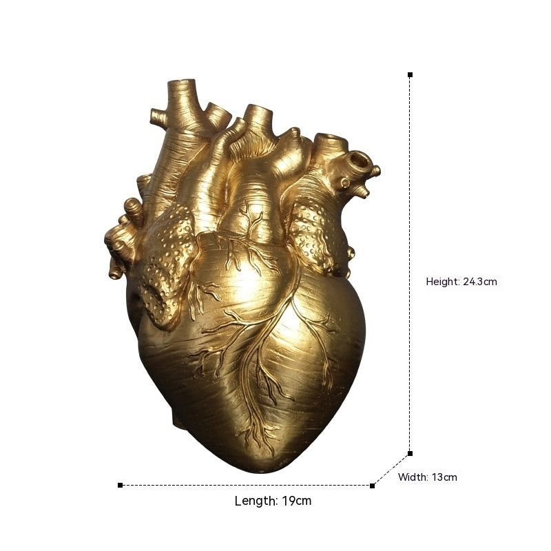 Gold heart-shaped object with measurements on a white background - Lioré®