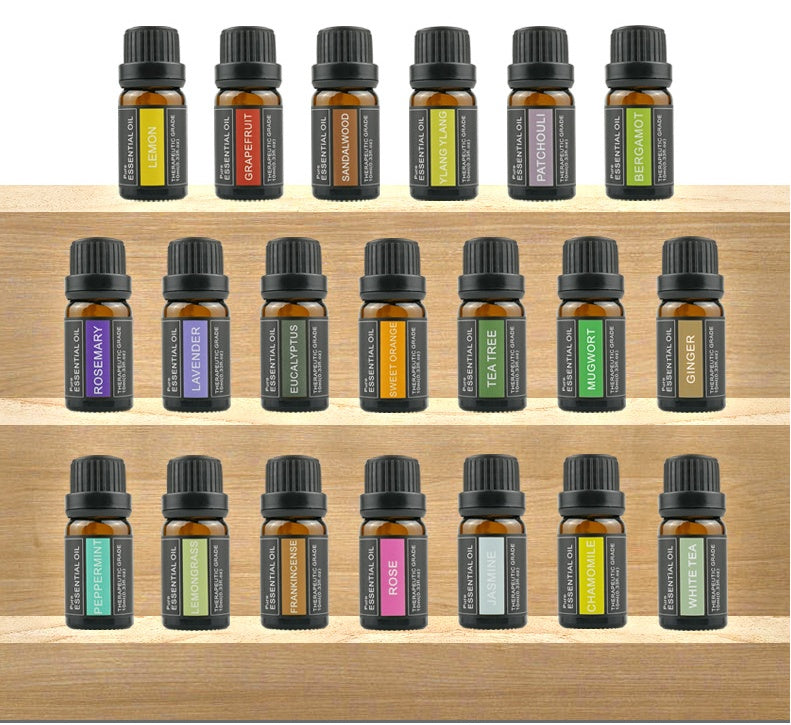 Collection of essential oil bottles on a wooden shelf - Lioré®