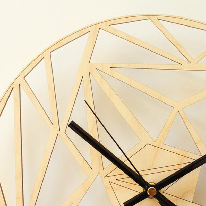 Geometric gold wall clock on a light background - Lioré