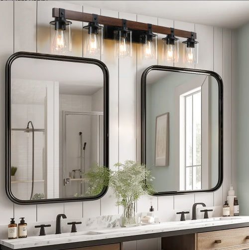 Bathroom vanity with two mirrors, lights above, and various toiletries. - Lioré® USA