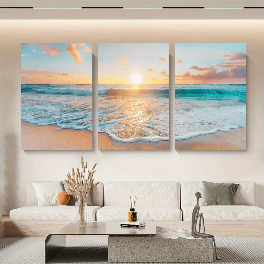 Three-panel canvas print of a beach sunset hanging on a wall above a living room. - Lioré® USA