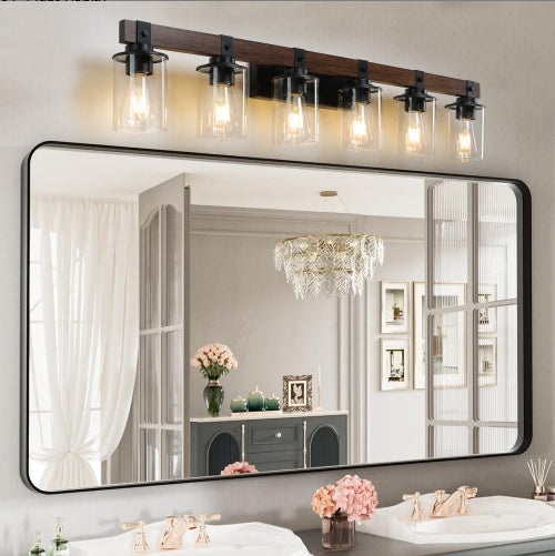Bathroom mirror with decorative light fixture above it - Lioré® USA
