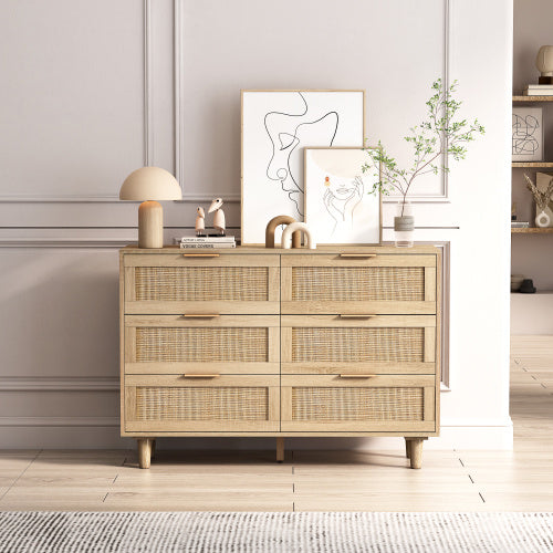 rattan dresser with wicker drawers in a room with decor elements. - Lioré® USA