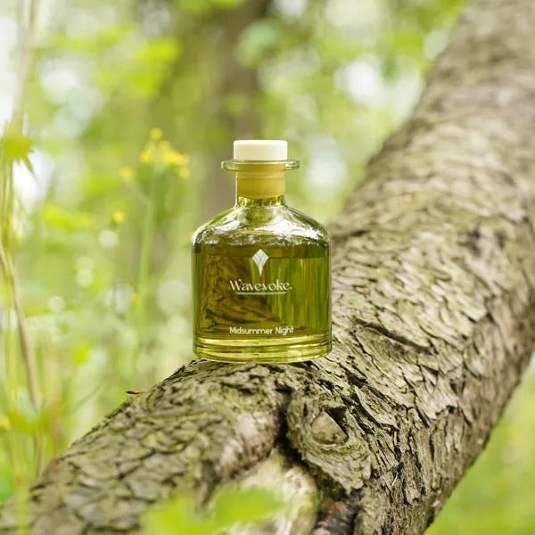 Bottle of 'Wavevoke' on a tree branch with a natural background - Lioré®