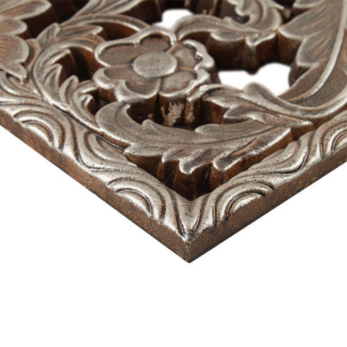 Decorative metal grille of wall panel with floral design on a white background - Lioré® USA