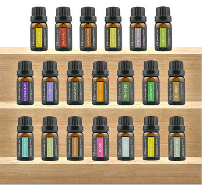 Collection of essential oil bottles on a wooden shelf - Lioré®