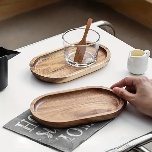 Wooden trays on a table with a glass of water and a spoon. - Lioré®