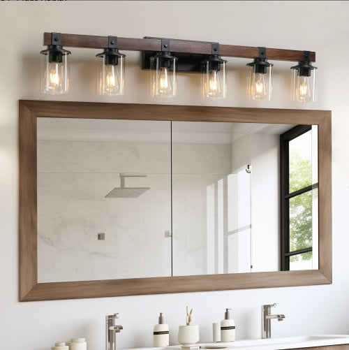 Bathroom mirror with wooden frame and four light fixtures above it. - Lioré® USA