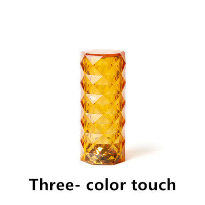 Orange LED lamp with textured design on a white background - Lioré® USA
