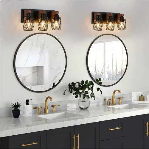 Bathroom vanity with round mirrors, gold fixtures, and decorative elements. - Lioré® USA